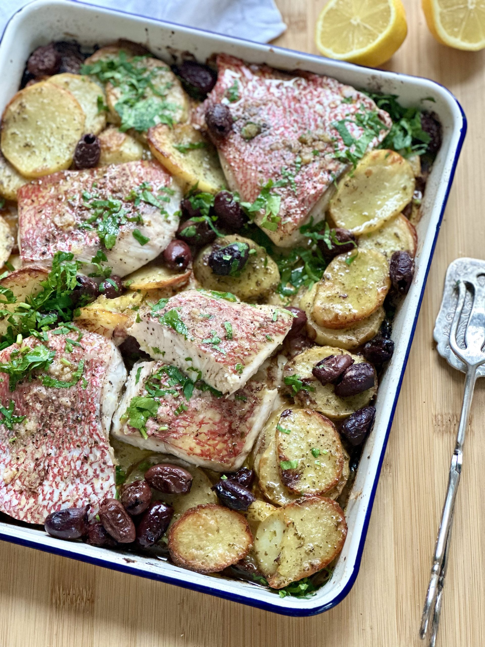 Baked snapper with potato and black olives